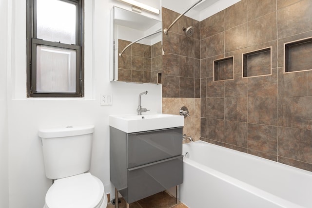 full bath featuring vanity, shower / tub combination, and toilet