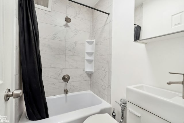 full bathroom with toilet, vanity, and shower / bath combination with curtain