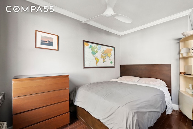 bedroom with crown molding, dark wood-style floors, and ceiling fan