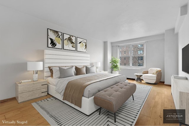 bedroom with light wood-type flooring