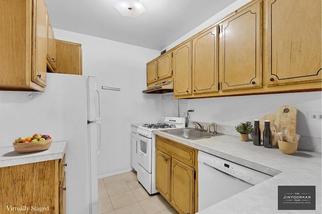 kitchen with sink, white appliances, and light tile patterned floors