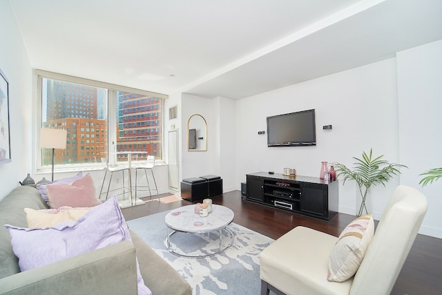 living room with dark hardwood / wood-style flooring