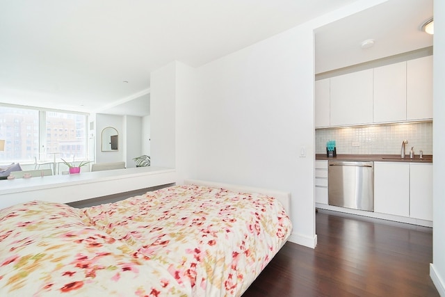 bedroom featuring dark wood-type flooring and sink