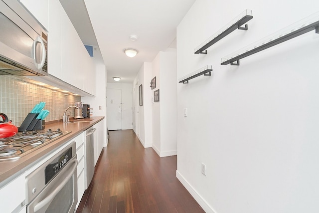 hall featuring dark hardwood / wood-style flooring and sink