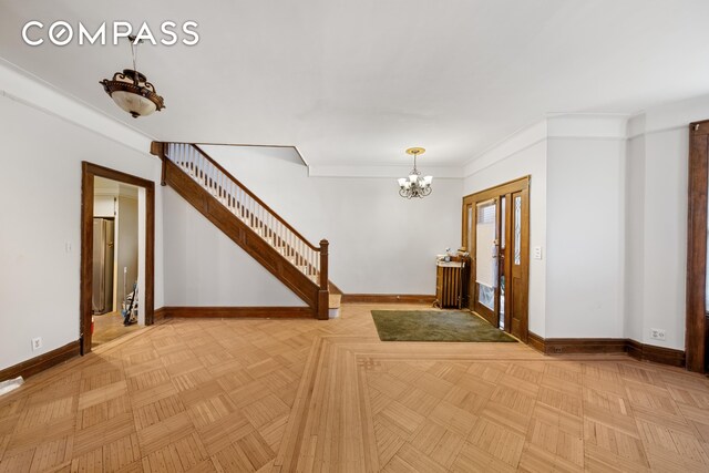 empty room with radiator heating unit and light parquet flooring