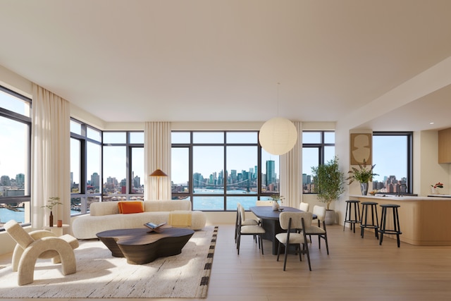 sunroom featuring a water view