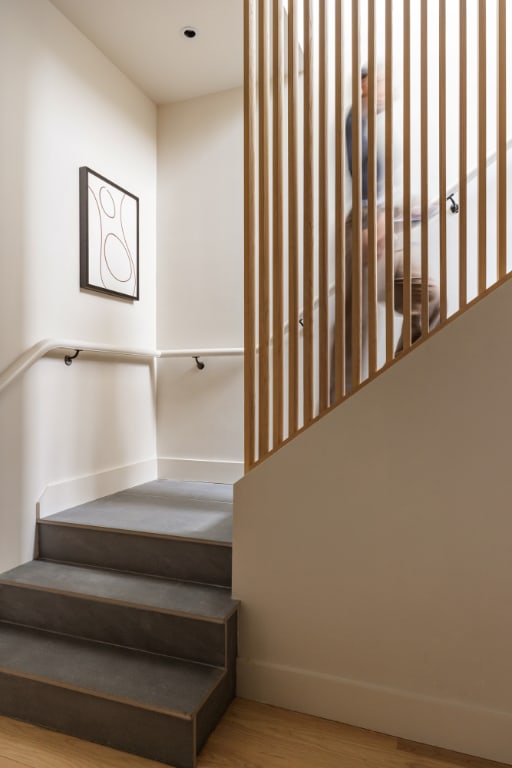 stairway featuring hardwood / wood-style floors