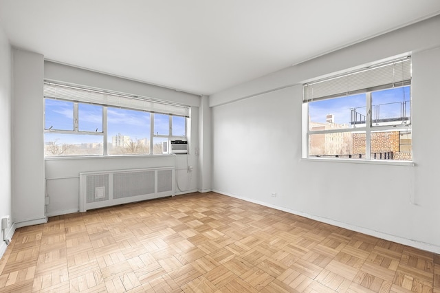 2727 Palisade Ave Unit 16-Ab, New York City, NY 10463 - spare room featuring radiator, baseboards, and cooling unit