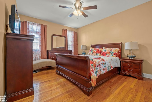 bedroom with ceiling fan and light wood-type flooring