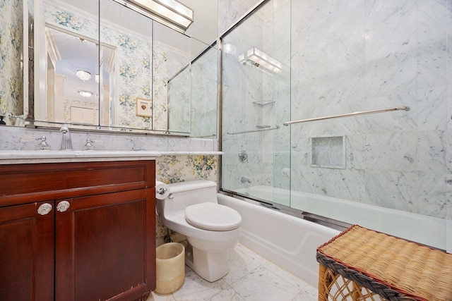 full bathroom with vanity, combined bath / shower with glass door, and toilet