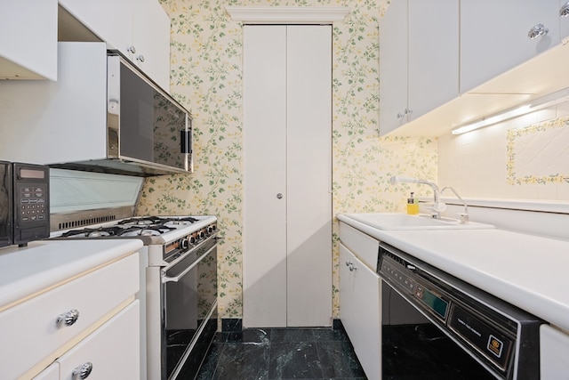 kitchen with white range with gas cooktop, sink, white cabinetry, and dishwasher