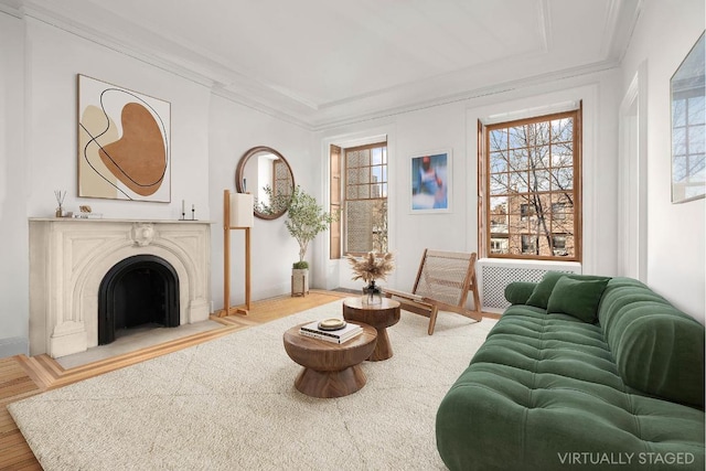 living room featuring ornamental molding and hardwood / wood-style floors