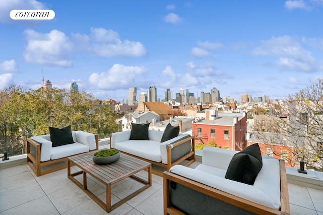 view of patio with an outdoor living space and a city view