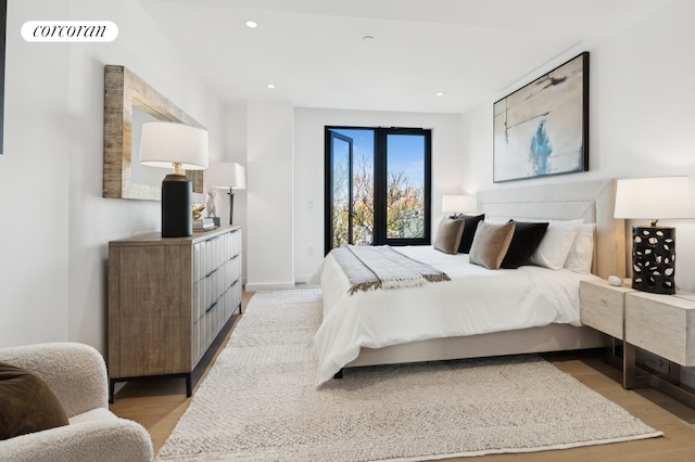 bedroom featuring recessed lighting, visible vents, baseboards, access to exterior, and light wood-style floors