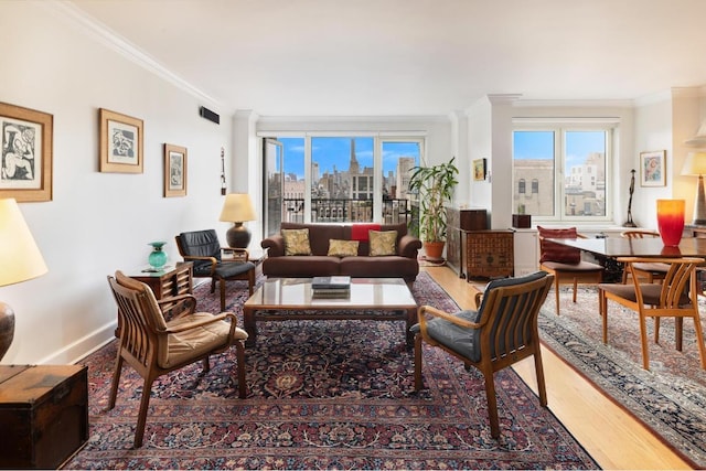 living room with hardwood / wood-style flooring and ornamental molding