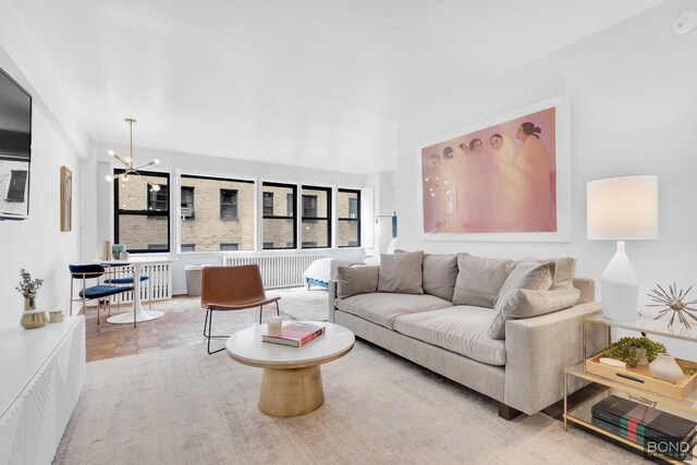 living room featuring a chandelier