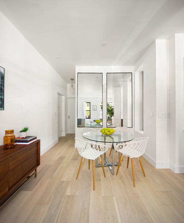 dining area with baseboards and light wood-style floors