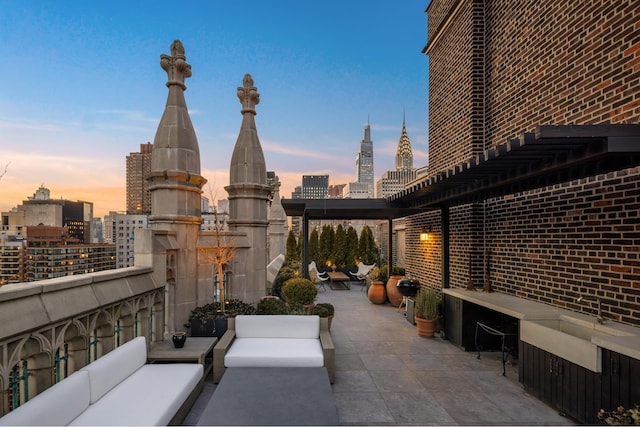 5 Tudor City Place Penthouse7, New York City, NY 10017 - view of patio featuring an outdoor living space and a skyline view