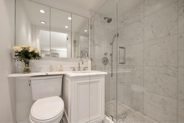 full bathroom featuring vanity, a marble finish shower, toilet, and recessed lighting