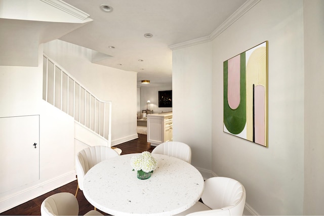 dining room with crown molding, dark wood-type flooring, stairway, and baseboards