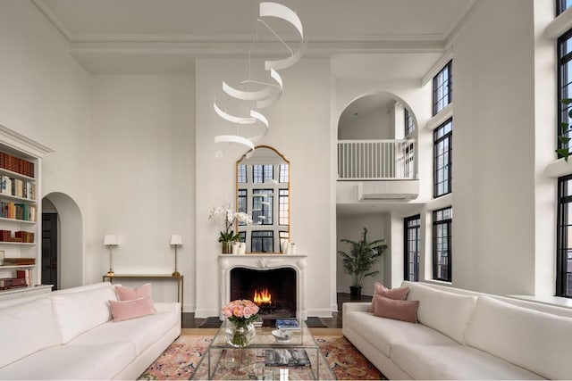 living room featuring crown molding and hardwood / wood-style flooring