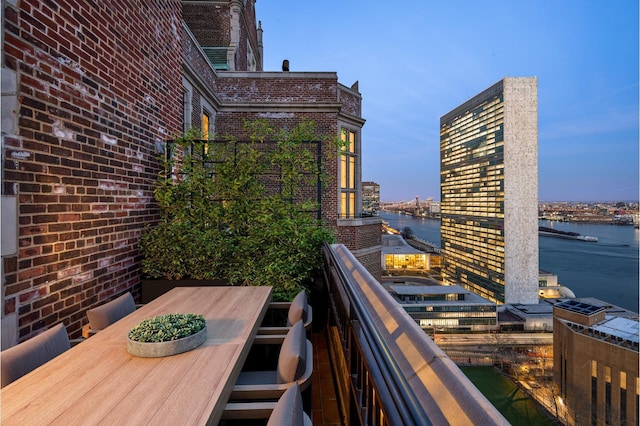 5 Tudor City Place Penthouse7, New York City, NY 10017 - balcony featuring a water view and outdoor dining space