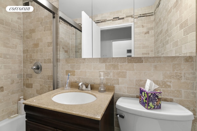 full bathroom featuring shower / bathtub combination, vanity, and toilet