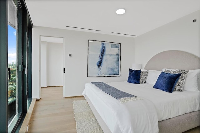 bedroom with light hardwood / wood-style flooring