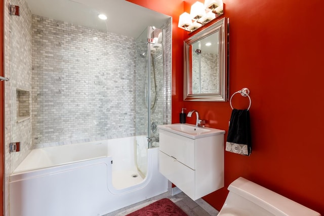 full bathroom with toilet, vanity, and tub / shower combination
