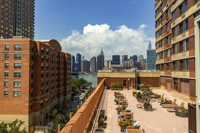 property's view of city featuring a water view