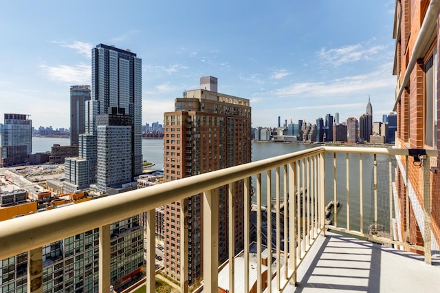 balcony featuring a water view and a view of city