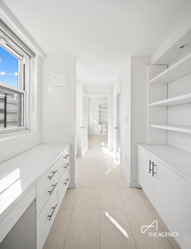 interior space featuring baseboards