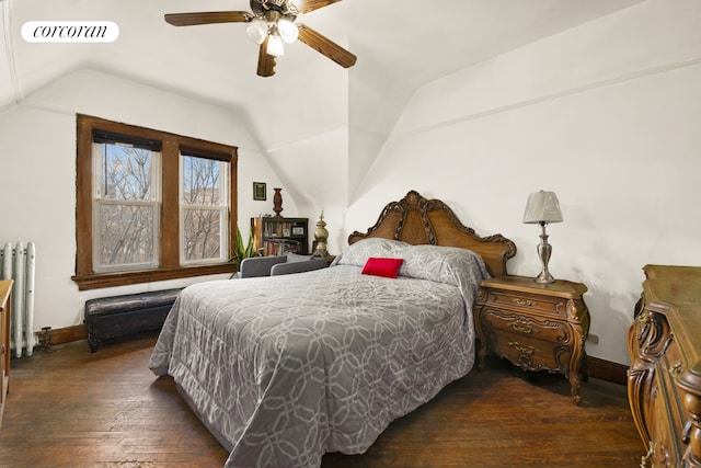 bedroom with wood-type flooring, visible vents, vaulted ceiling, and radiator heating unit