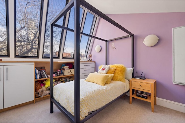 bedroom featuring light colored carpet