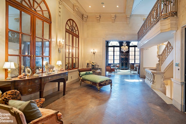 15 E 63rd St, New York City, NY 10065 - interior space featuring a towering ceiling, crown molding, a chandelier, and access to outside