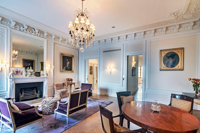 dining room with parquet floors, crown molding, and a notable chandelier