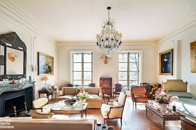 living area with parquet flooring, ornamental molding, and a notable chandelier