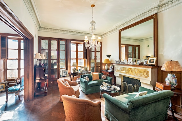 living room with an inviting chandelier and ornamental molding