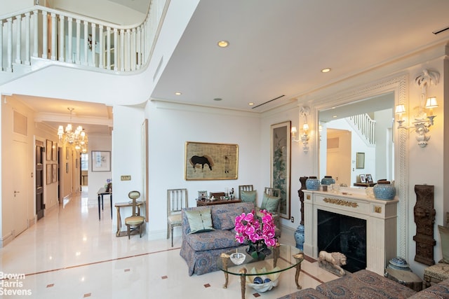 living room featuring crown molding and a notable chandelier