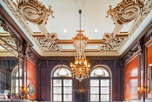 details featuring crown molding, coffered ceiling, and a chandelier