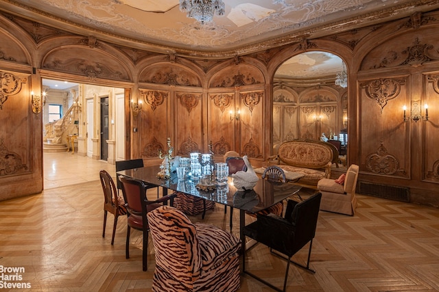 dining space featuring light parquet flooring