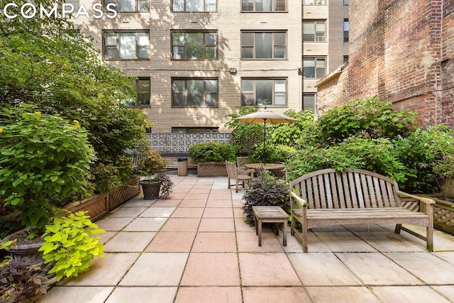 view of property's community with a patio area