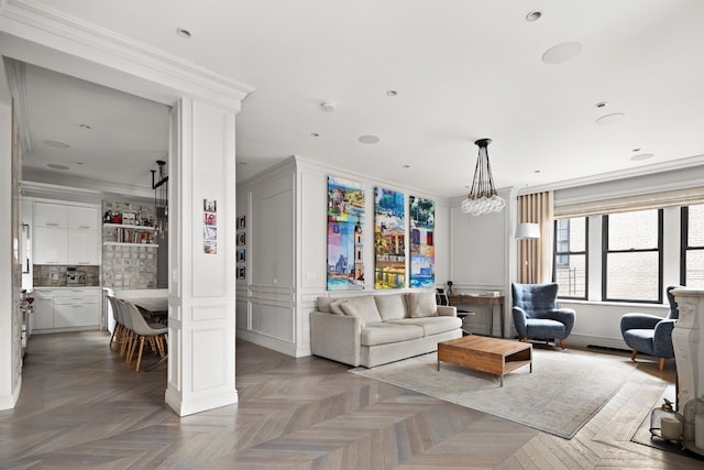 living room featuring parquet floors and ornamental molding