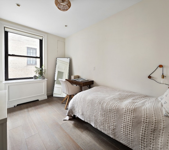 bedroom with wood-type flooring