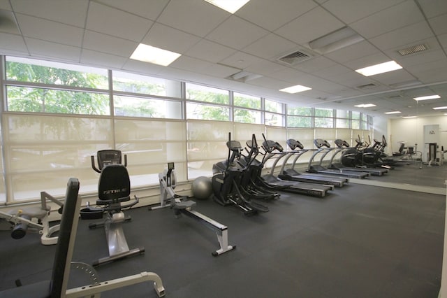 workout area featuring a drop ceiling