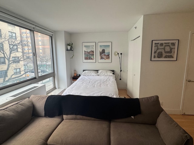 bedroom with light hardwood / wood-style floors