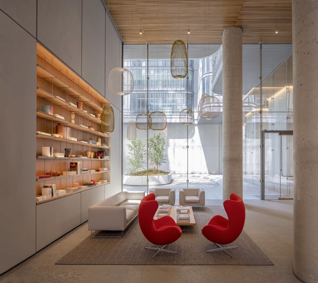 community lobby featuring expansive windows and a high ceiling