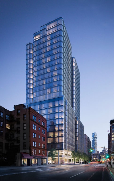 property at dusk with a city view