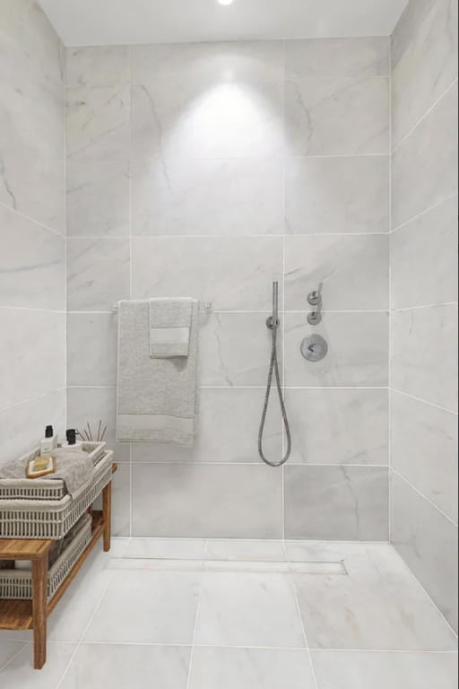 bathroom with a tile shower