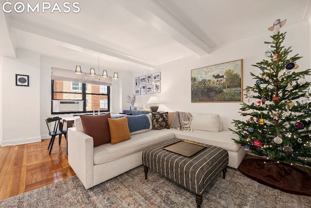 living room with parquet floors, cooling unit, and beamed ceiling